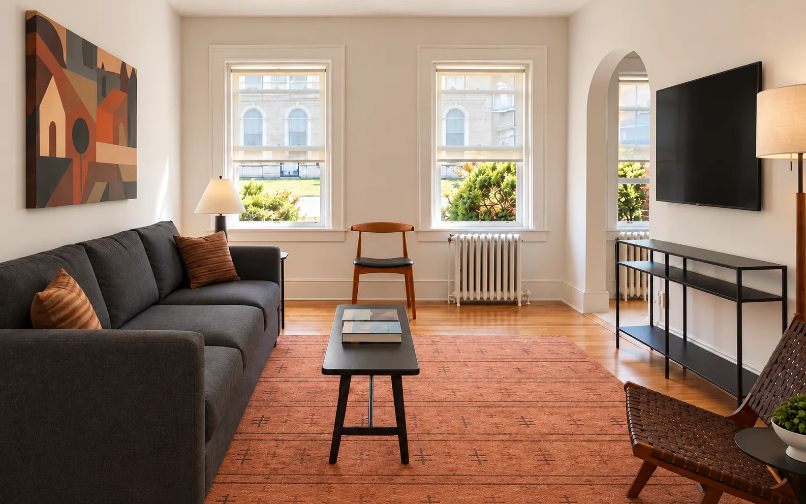 Illustrative living room with sofa and tall windows